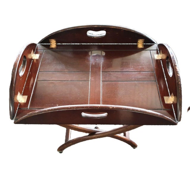 Magnificent folding marine table called “Buttler tray” in mahogany. Table convertible into a serving tray. Tray with...