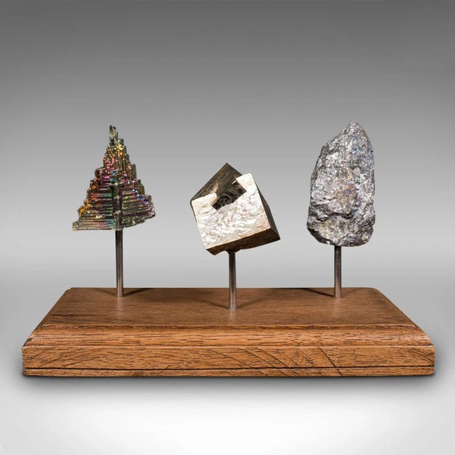 This is a set of vintage rare earth metals. A Continental, bismuth, pyrite and galena decorative display on oak plinth,...