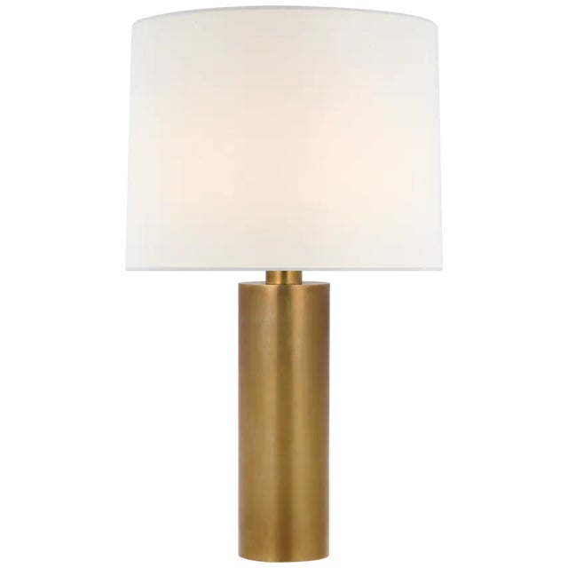 The Silvie Table Lamp by Paloma Contreras offers an elegant lighting solution. The streamlined, elongated base comes in a...