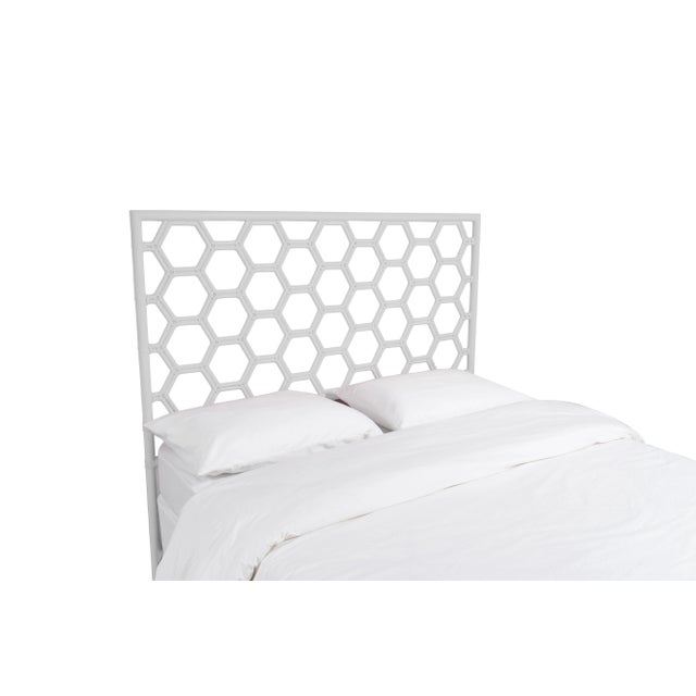 This headboard features classic Rattan design in a geometric pattern. Constructed of solid rattan and hand bound with...