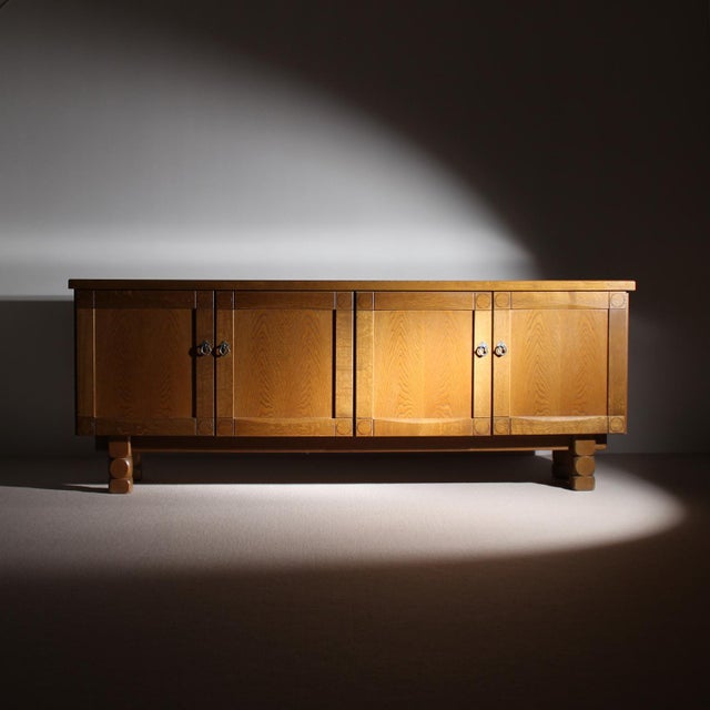 ​This impressive sideboard stands out with its striking brutalist design language and high-quality solid oak...