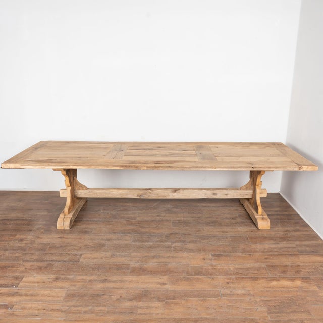 This dramatic bleached oak dining table from France with impressive trestle base is over 10' long. Enlarge photos to...