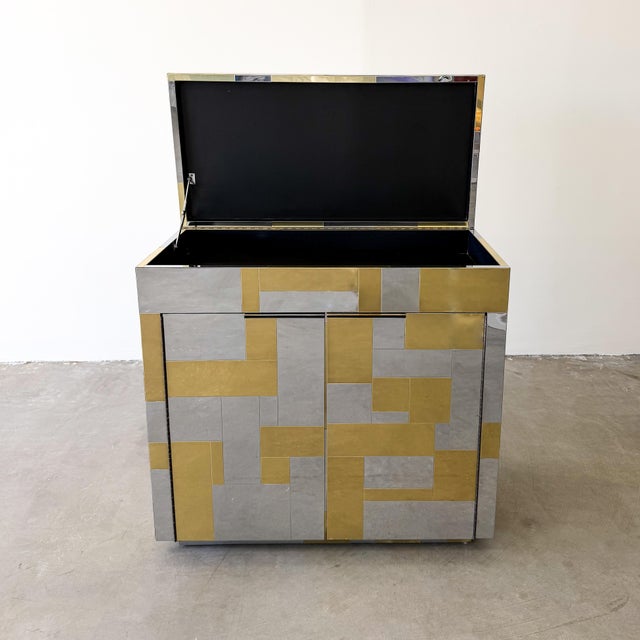 An exceptional 1970s Paul Evans Cityscape bar cabinet featuring a striking combination of polished chrome and brass. This...