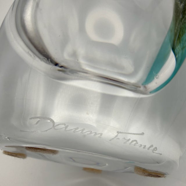 This piece captivates with its sculptural presence and the exceptional quality of the crystal glass used. The vase is...