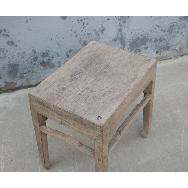Hand-shaped from solid elm and carrying the deep, weathered patina only decades of daily use can produce, this vintage...
