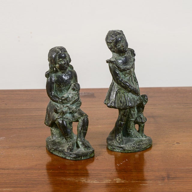 This pair of ceramic figurines, depicting delicate doves, represents a poetic example of mid-twentieth-century period...