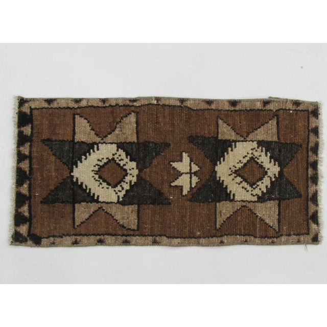 Handknotted vintage decorative mini rug from Kars region of Turkey. Approximately 50-60 years old. In very good condition.