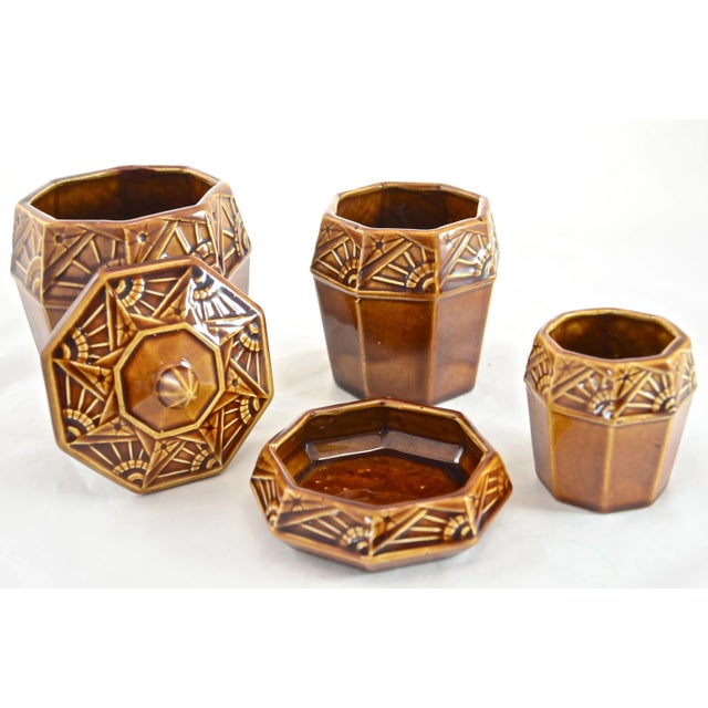 Antique circa 1890 Frie Onnaing majolica four-piece desk or smoking set with an Art Deco motif in warm chocolate brown...
