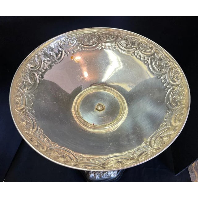 Tall Victorian silver plate chased compote on a twelve leaf palm tree and elephant resting on a chased base of plants and...