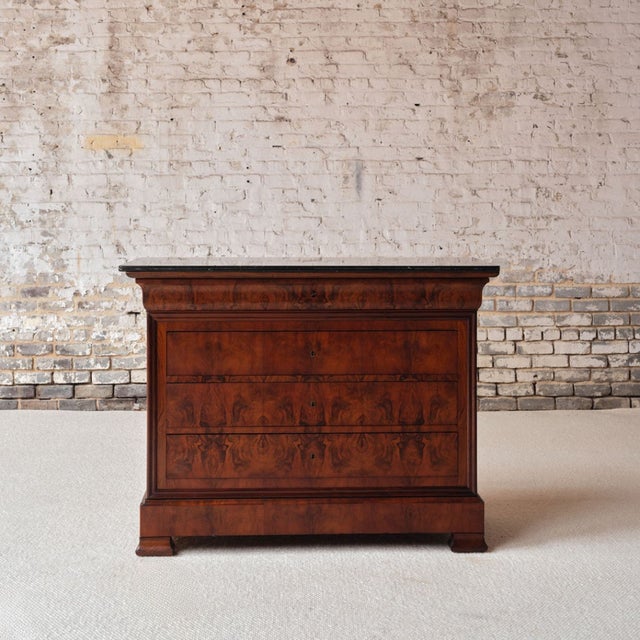 Add timeless French elegance to your space with this Louis Philippe period marble top commode, circa 1850, a beautifully...
