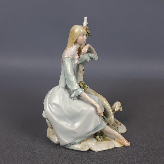 Wonderful vintage decorative sculpture, depicting a shepherdess sitting with sheep, made of fine Capodimonte porcelain,...