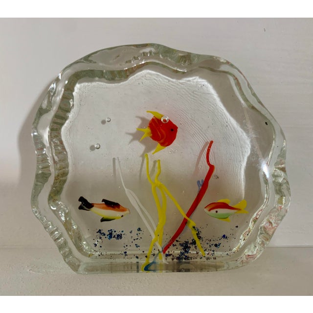A glass Murano fish aquarium paperweight. Made in Venice, Italy it shows Italian craftsmanship. Three fishes swimming...