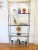 This is a mid century modern Maison Jansen style shelving unit. It has a beautiful chrome frame with brass accents, and...