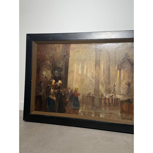 Atmospheric antique oil on canvas depicting a tranquil church interior with worshippers gathered in prayer. The artist...