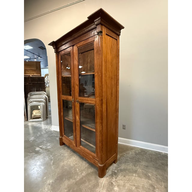 19th C. French Bibliotheque in walnut with glass front doors and adjustable shelves.