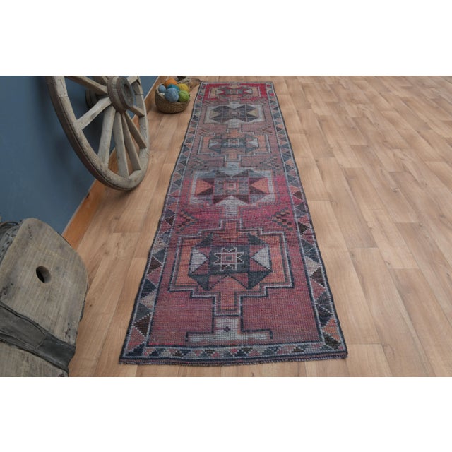 Vintage Turkish Hand-Knotted vintage rug is a semi-antique vintage runner rug. The '70s Eastern region of Turkey's unique...