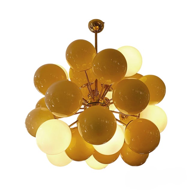 A truly unique and special ceiling lamp. This piece reinterprets the Sputnik style, featuring an interior structure in...