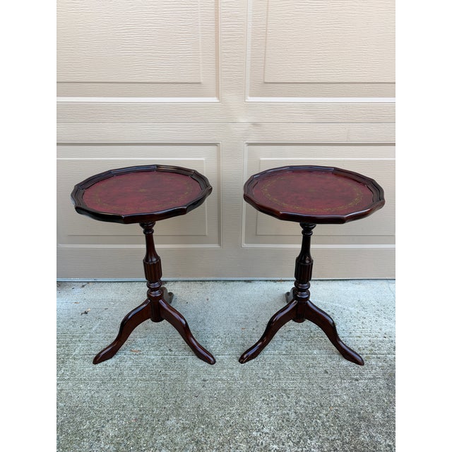 A gorgeous pair of Georgian style round scalloped edge side tables or drinks tables USA, Circa 1980s Carved mahogany, with...