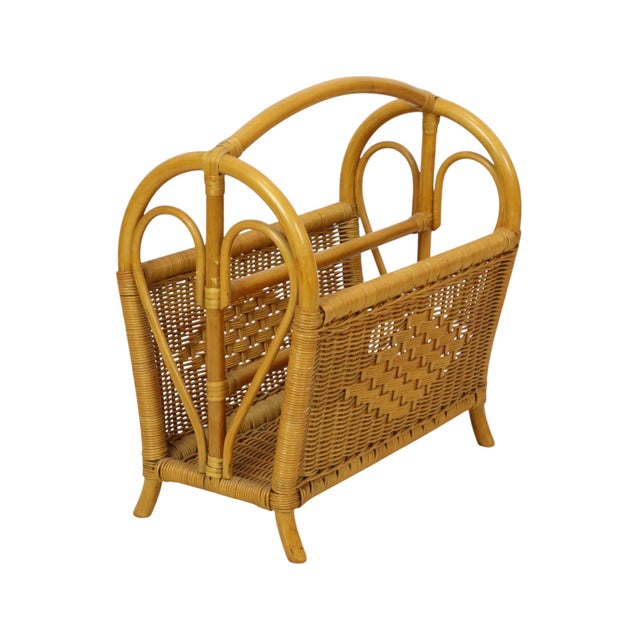 Vintage magazine rack made of bamboo and rattan, featuring a distinct bohemian style; Netherlands, circa 1980s. This item...