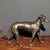 This charming antique gilt bronze figurine depicts a standing dog, a traditional symbol of loyalty, protection, and good...
