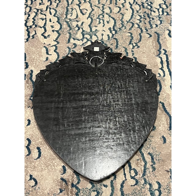 Beautiful Venetian glass embellished mirror mounted on black painted wooden backing