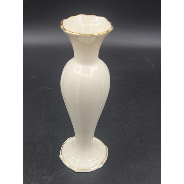Beautiful vintage ivory Lenox Special Bud Vase. Fluted style with gold accents on the top rim and around the base. No...