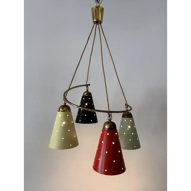 Extremely rare, lovely and highly decorative mid-century modern four-armed mid-century modern pendant lamp or chandelier....