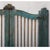 Called a "dog door" in India, this arched top gate with iron security rods above a paneled base, has shaped center and...