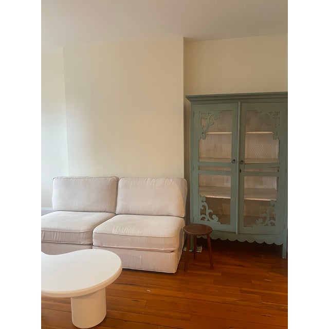 A truly one-of-a-kind antique display cabinet that makes an instant statement in any room. Painted in a soft, dusty...