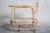 Rattan serving trolley manufactured in the 1960s by Rohé Noordwolde, entirely made of rattan with a glass top and bottom....