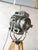 A 2kw fresnel cinema spotlight by arnold & richter of munich from the 1950s, in original grey paint, standing on an...