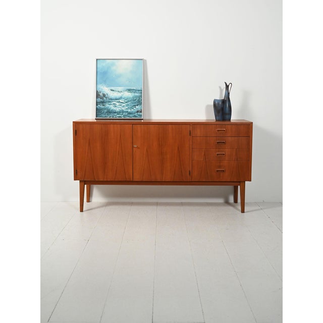 Scandinavian teak sideboard, early 1960s, central doors and side drawer unit, compartment with shelf, original key. Early...