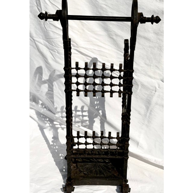 A very intricately worked late Victorian or Aesthetic Movement wrought and cast iron tall stand for umbrellas, walking...
