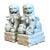 Crafted in the classic Dehua tradition, this pair of vintage Blanc de Chine porcelain foo dogs radiates timeless elegance...