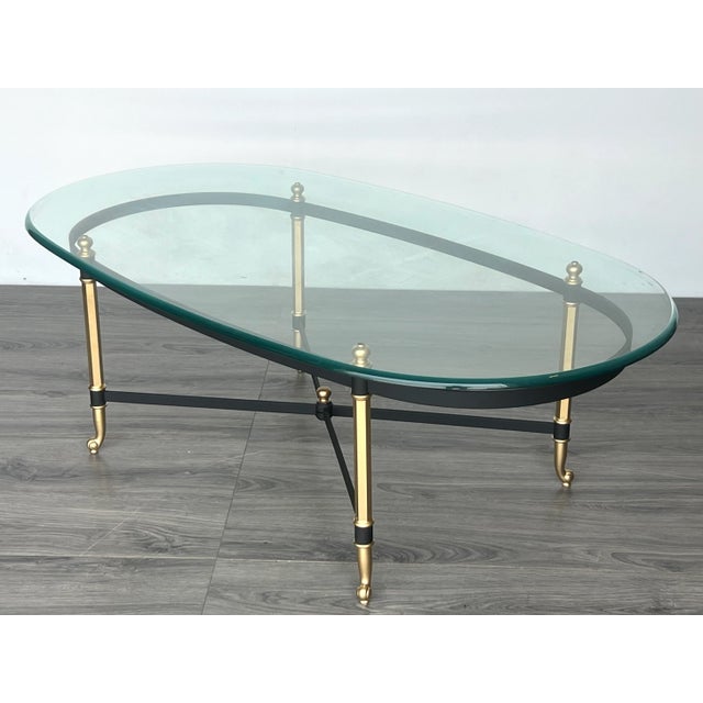 Late 20th century Italian coffee table this table has been refinished in mate black with gold finish Dimensions: 50"Width...
