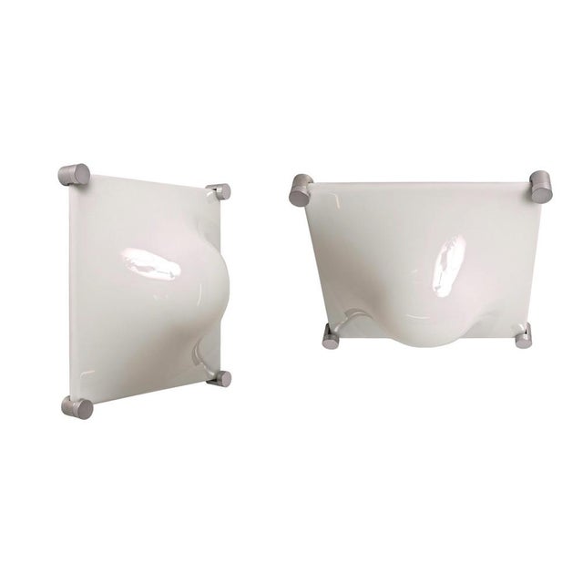 Wonderful midcentury pair of "Bolla Lamp" in white acrylic glass. Elio Martinelli designed these items were produced in...