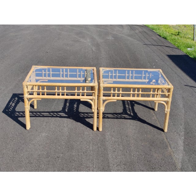 Add a touch of coastal charm to your living space with this set of three vintage boho chic style rattan coffee and end...