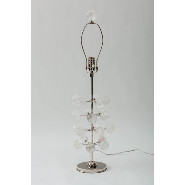 Pair of hand polished rock crystal orb tree lamps with nickel plated solid brass circular bases and hardware. Solid rock...