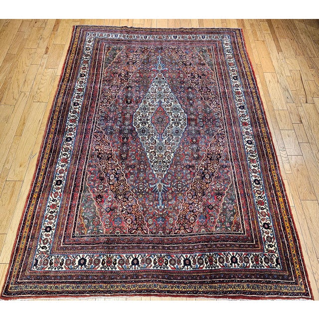 "An exceptional vintage Persian Bibikabad rug from the early 20th century, showcasing the traditional Herati pattern with...