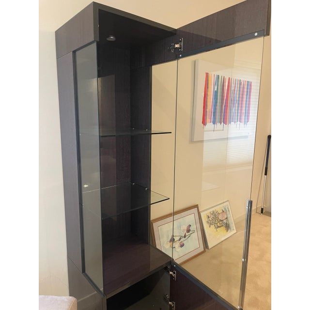 This lighted display cabinet is in mint condition. It has a clean modern design, provides display and storage, is barely...