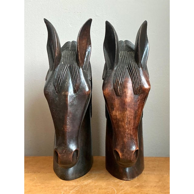 Celebrate the timeless beauty of equestrian art with this pair of vintage hand-carved wood horse head sculptures. Expertly...