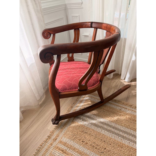 Elegant vintage Regency-style klismos armchair crafted in richly toned mahogany, featuring gracefully scrolled arms,...
