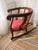 Elegant vintage Regency-style klismos armchair crafted in richly toned mahogany, featuring gracefully scrolled arms,...