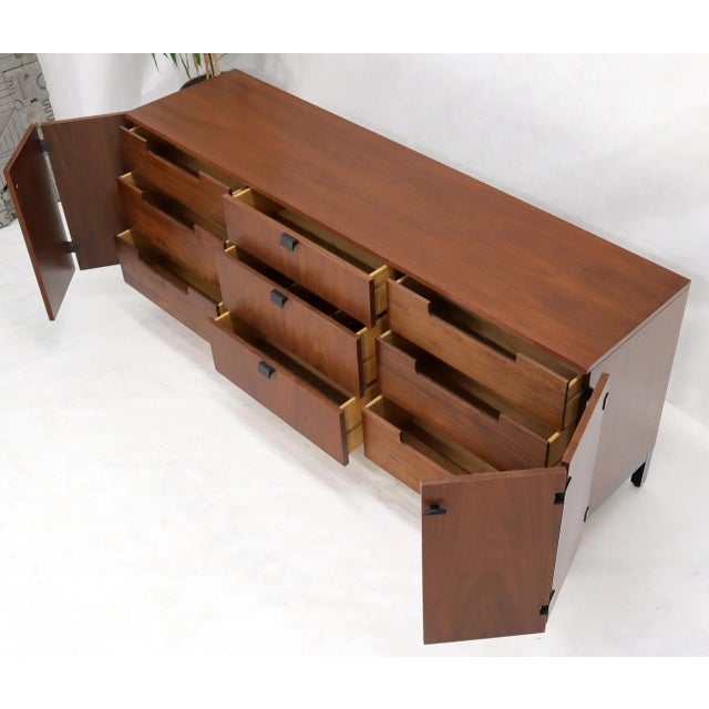Mid-Century Modern American walnut long dresser credenza fully restored. Beautiful bookmached veneer pattern.