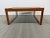 Design Plus Gallery presents a Mid Century Teak and Glass Coffee Table. A simple sled silhouette is crafted from teak and...