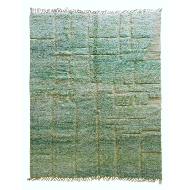 Add a natural touch to your home with our Middle Atlas rug. Measuring 11.3 by 8.3 feet, this rug features a subtle...