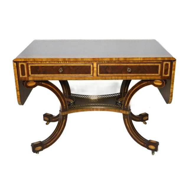 Henredon Regency style drop leaf sofa table having two frieze drawers to the front, raised on four legs untied by a...