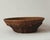 Hand-woven wicker basket with shaped rattan lip rim. Warm honey-brown patina; tight weave throughout. Functional display...