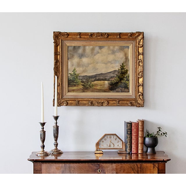 A beautiful rolling landscape oil on canvas painting, signed in the lower left corner. Presented in it's original hand-...