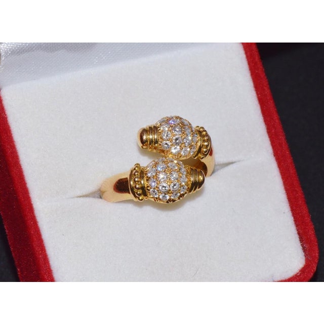 Vintage 18K solid gold diamond Etruscan beaded bypass ring. Very detailed and extremely fine design. This ring features a...
